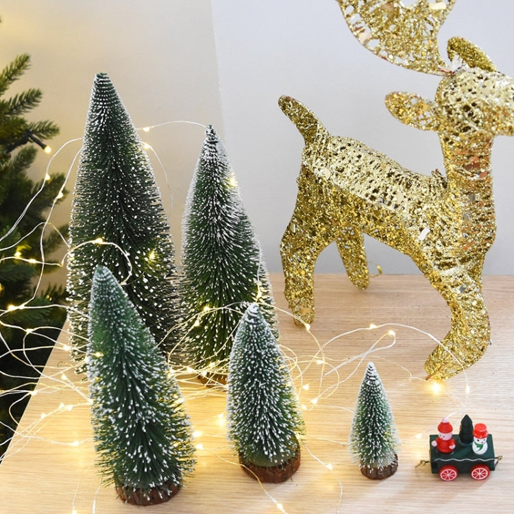 Set of small artificial Christmas trees, dark green bristle cones on wooden bases