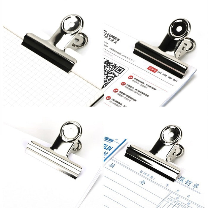 Chrome-silver round binder clips holding office document corners