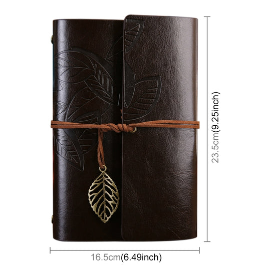Dark brown embossed travel diary notebook with leaf details, wrap strap, and hanging leaf charm; size shown