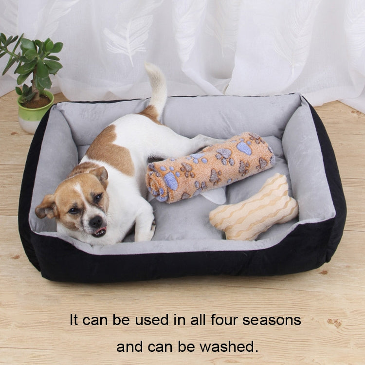 Black and gray pet kennel mat with gray cushion and two bone-shaped pillows