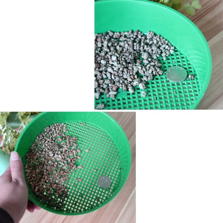 Green plastic mesh sieve holding soil sample, round grid base with small center marker