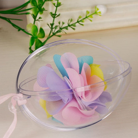 Clear plastic oval hanging ornament with pastel flower and ribbon accents