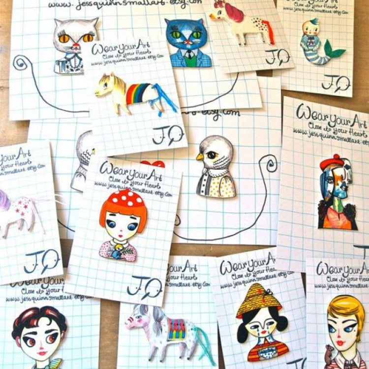 Multiple character charm designs on sheets, ready for heat-shrink film use