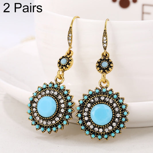 Gold-tone turquoise rhinestone flower drop earrings with round light-blue center stones