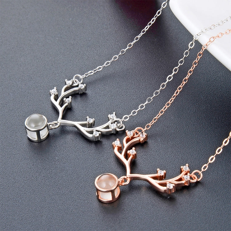 Rose-gold and silver tree-branch pendant necklaces with round memory stones and zirconia