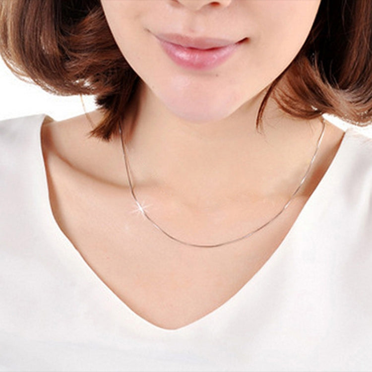 Silver snake bone chain necklace worn on neck, thin 1mm links, 28-inch length