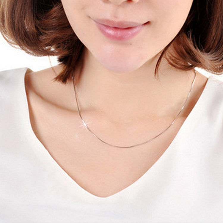 Silver snake-bone link chain necklace on model neckline, slim 2mm, 24 in