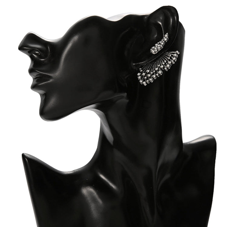 Silver rhinestone fan-shaped asymmetric stud earrings on a black mannequin head