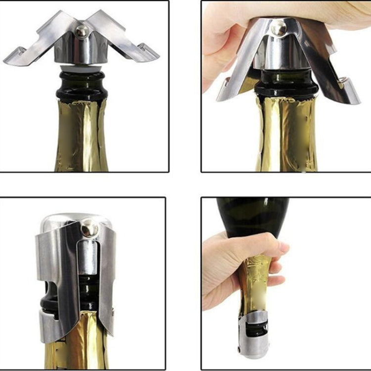 Stainless steel champagne stopper on bottle, hands showing clamp arms and seal