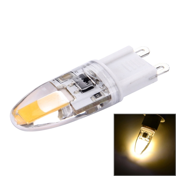 Dimmable G9 LED bulb with warm yellow glow, clear capsule and two-pin base