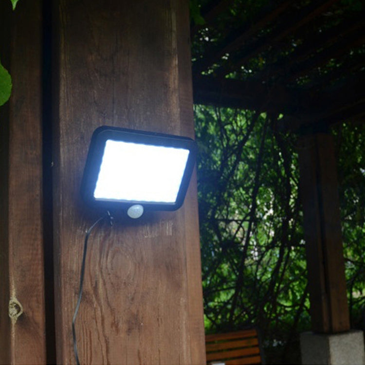 Solar wall light with COB LED glow and round motion sensor, black housing