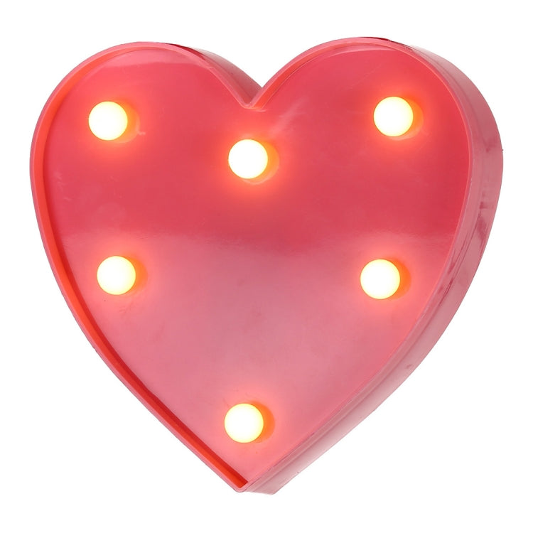 Pink heart-shaped battery night light with warm glowing LEDs in heart pattern