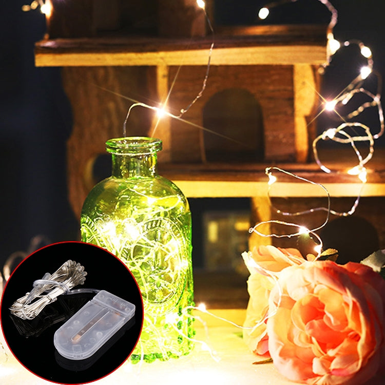 LED string lights with button battery holder and clear wire clips