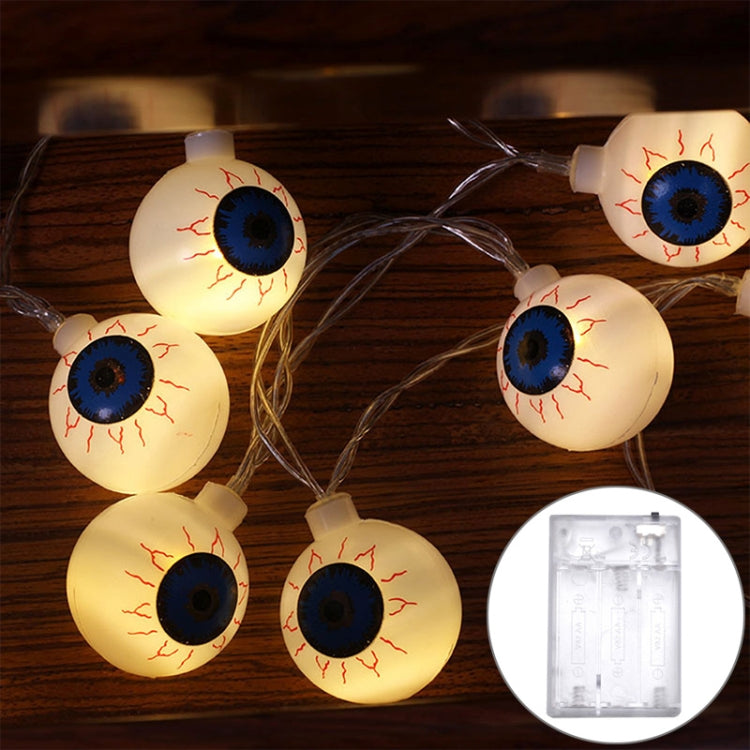 Warm-lit eyeball LED string lights with white bulbs and blue eyes on wire