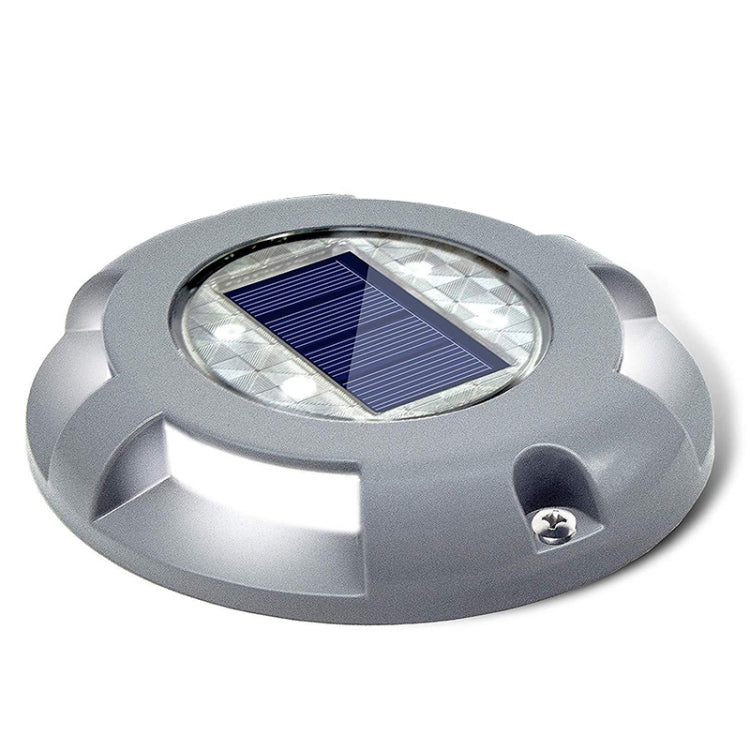 Grey round solar LED embedded ground lamp with blue solar panel and clear lens
