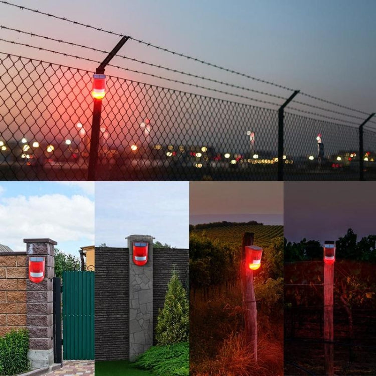 Red solar alarm warning light mounted outdoors with illuminated front lens