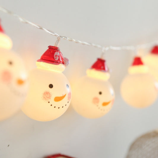 Warm white snowman LED string lights with glowing snowman bulbs and red caps on wire