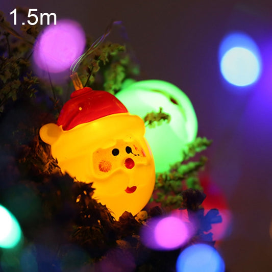 Santa Claus LED string light with glowing face on multicolor fairy lights strand