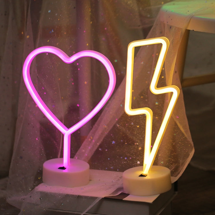 Neon-style heart and number 4 night lights with warm LED glow and round white bases