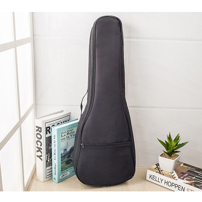 Dark padded ukulele bag standing upright with zipper and carry handle