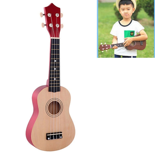 Children's basswood ukulele with natural body, red headstock, and black fretboard.