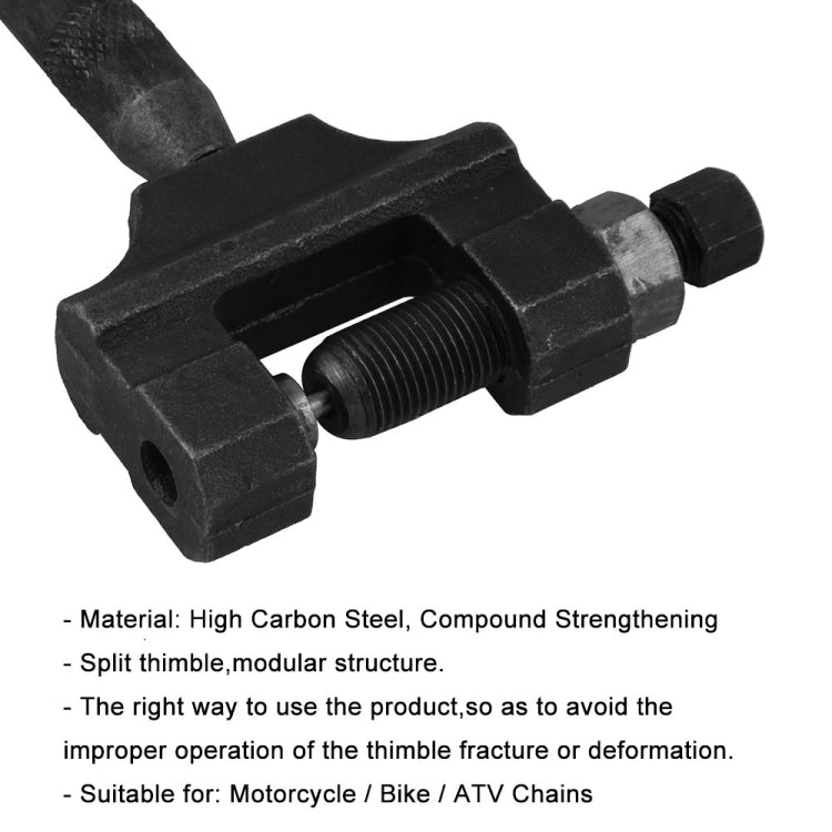 Black chain breaker tool close-up with threaded press mechanism and jaw clamp
