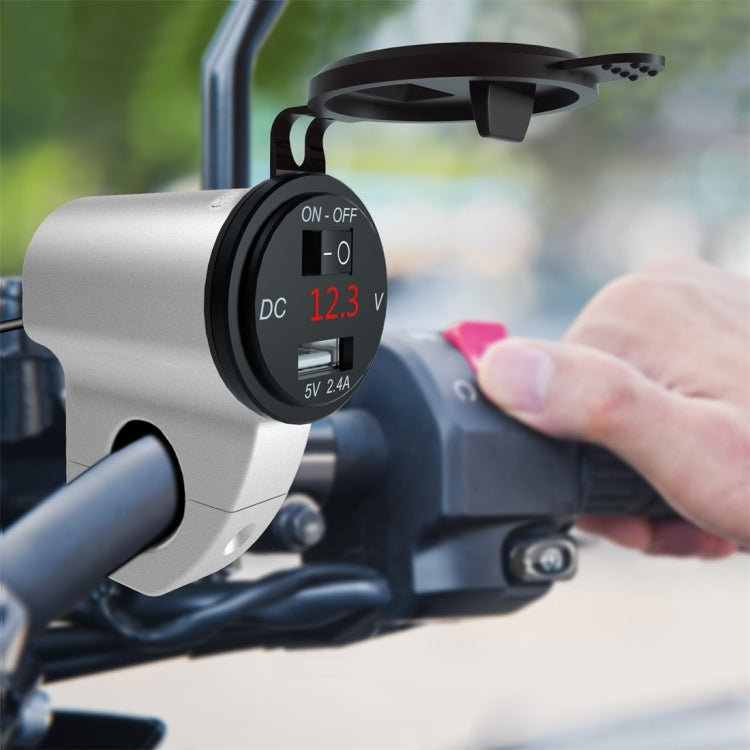 Motorcycle USB charger with red 12.3V voltmeter mounted near the handlebar