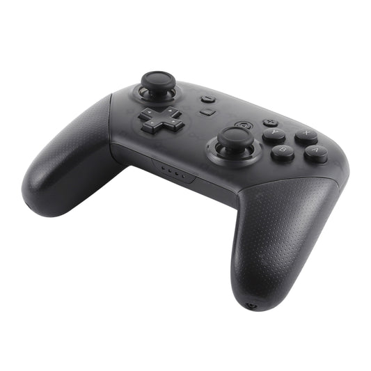 Black wireless game controller angled view with textured grips, D-pad, and thumbsticks