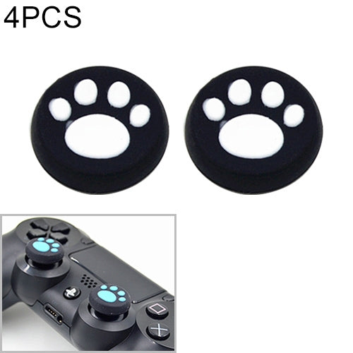 Two cat-paw silicone joystick covers, black with white paw print design