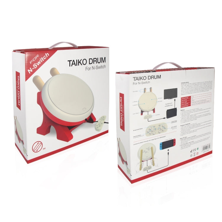 Taiko drum controller kit retail boxes showing cream drum, red stand, and yellow sticks