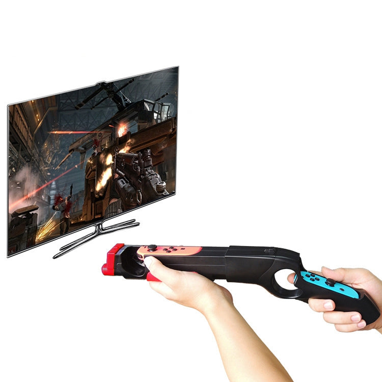 Hand holding black game gun handle holder with red and blue Joy-Con grips