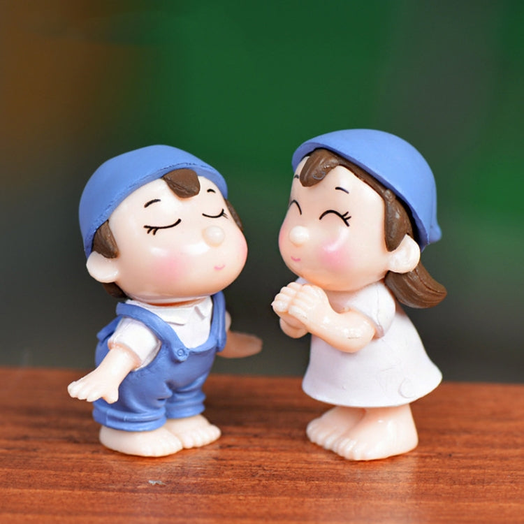 Blue hooded dollhouse ornament pair of PVC boy and girl figurines standing on a wood base