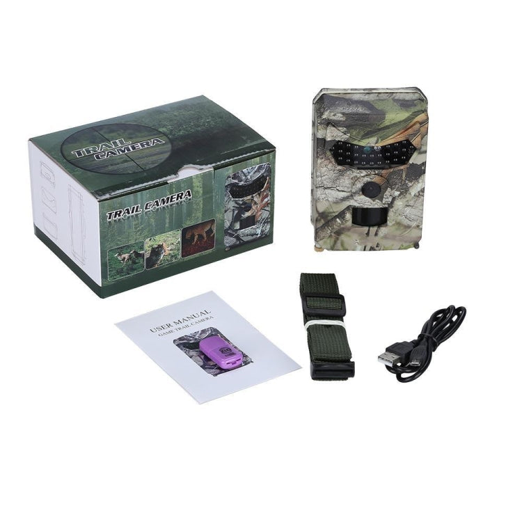Camouflage trail camera kit with box, manual, mounting straps, and cables