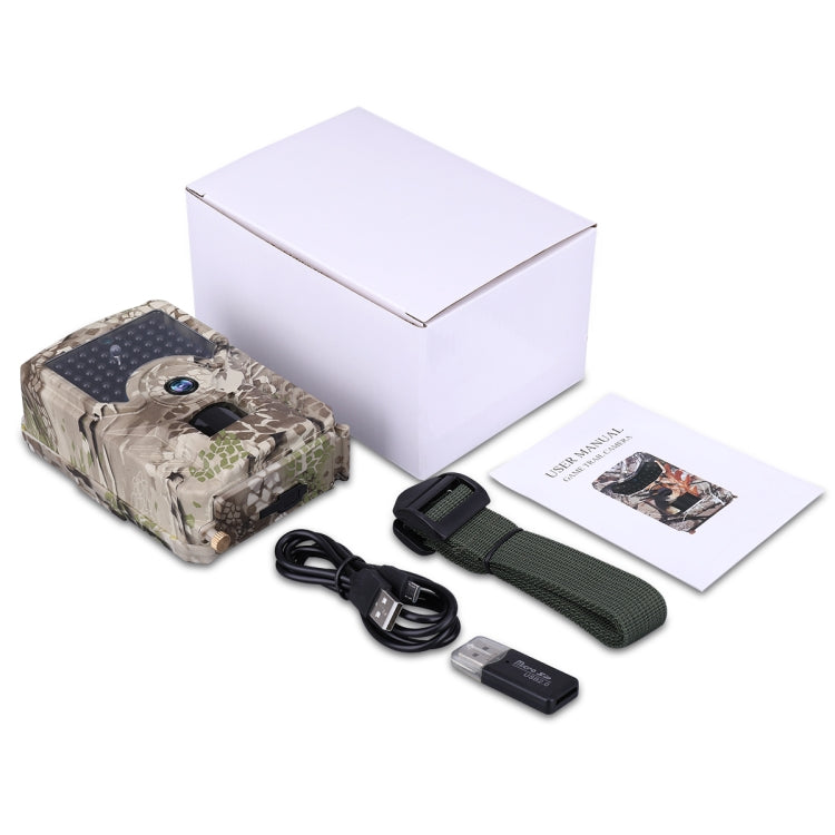 Camo trail camera kit with box, USB cable, strap, and instruction booklet