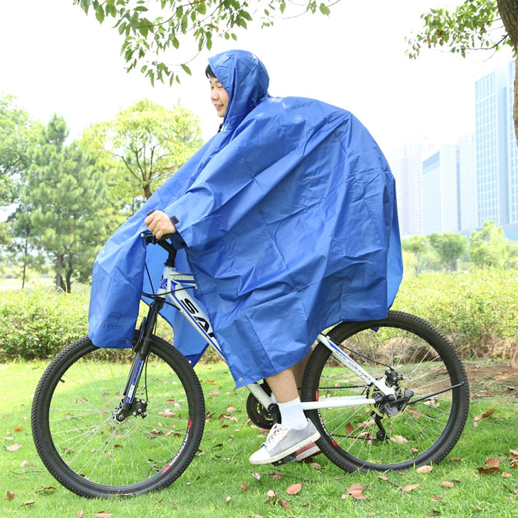 Blue hooded rain poncho worn while riding a bicycle, cape draped over legs