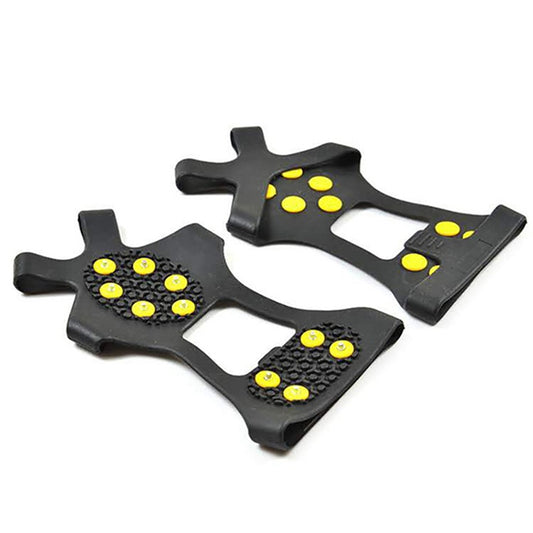 Black ice cleat shoe covers with yellow traction nubs, shown laid out