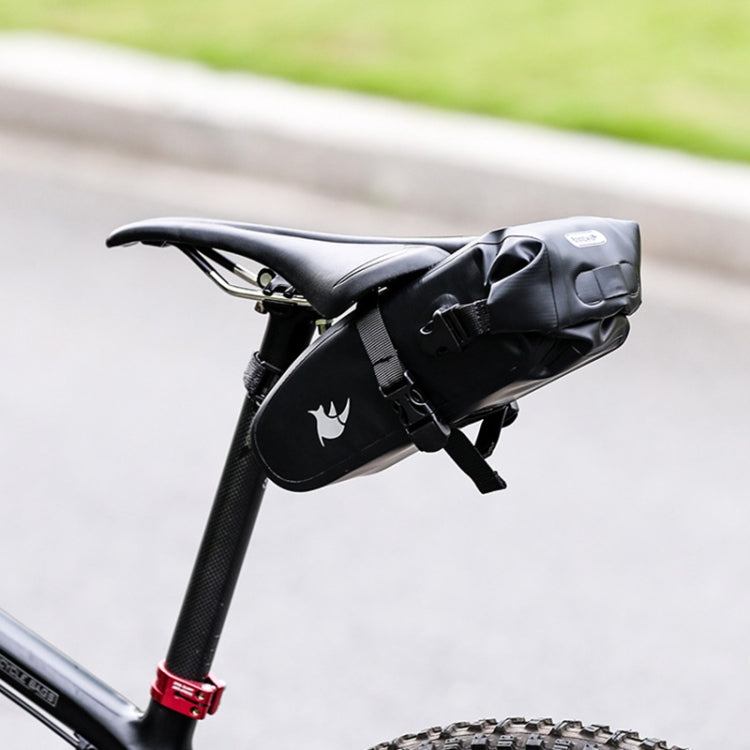 Black bicycle saddle bag mounted on bike with rear mounting straps and logo panel.