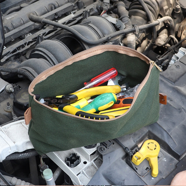 Open army green canvas tool pouch with zip, filled with assorted hand tools