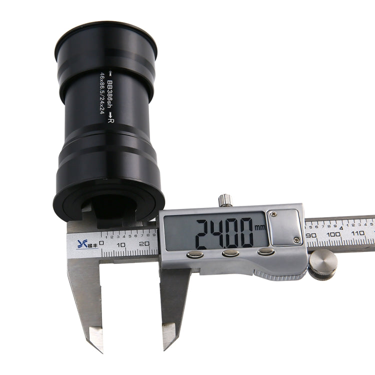 Caliper measuring 39mm on a black BB386 press-fit bottom bracket cup