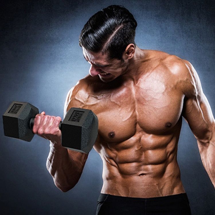 Man exercising with black hex dumbbells, red hex end inserts, gripping handles