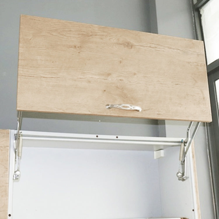 Vertical lift door support installed on cabinet door with metal hinges and struts