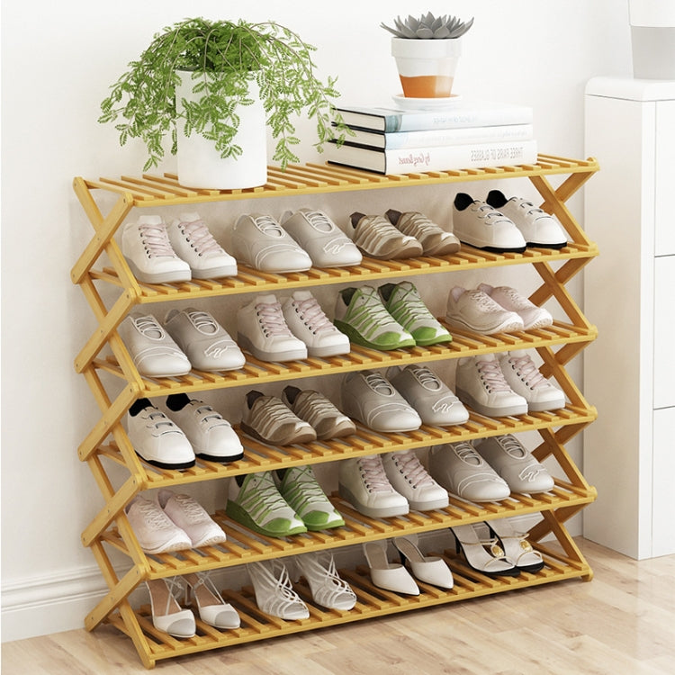Four-tier wooden slat shoe rack with open shelves for storing pairs of shoes