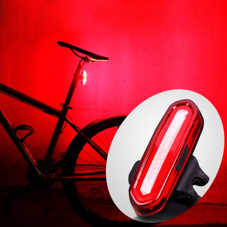 Red LED bike taillight with black strap and white backing disc