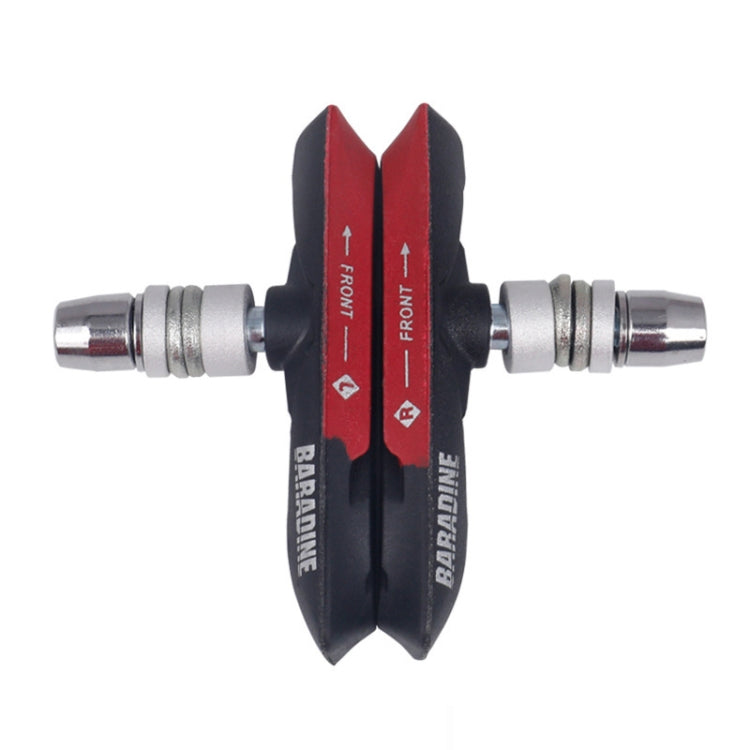 Red bicycle disc brake pads with metal mounting hardware and front direction arrows