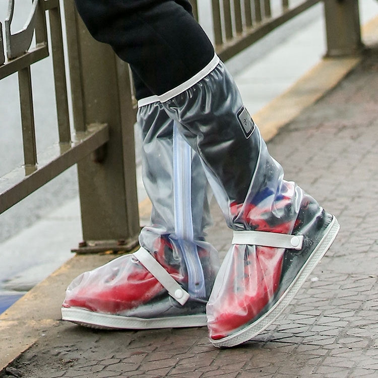 Transparent rain boot covers with elastic cuffs and strap, over sneakers