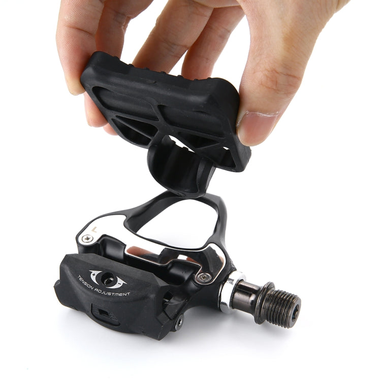 Black cycling adapter pedal with silver threaded axle and adjustable cleat mechanism