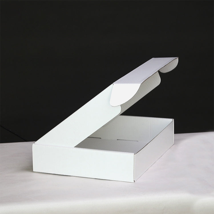 White long shipping box with partially open lid and interior visible
