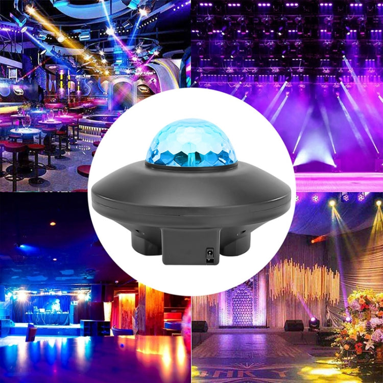 Black laser star projector light with blue faceted dome, front close-up