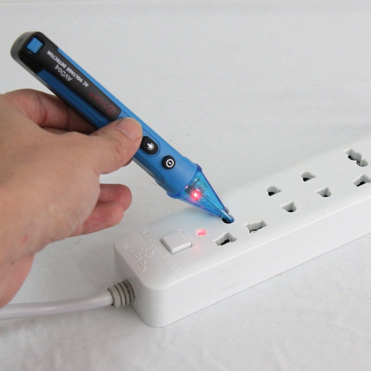 Non-contact AC voltage detector testing a power strip outlet with indicator light on