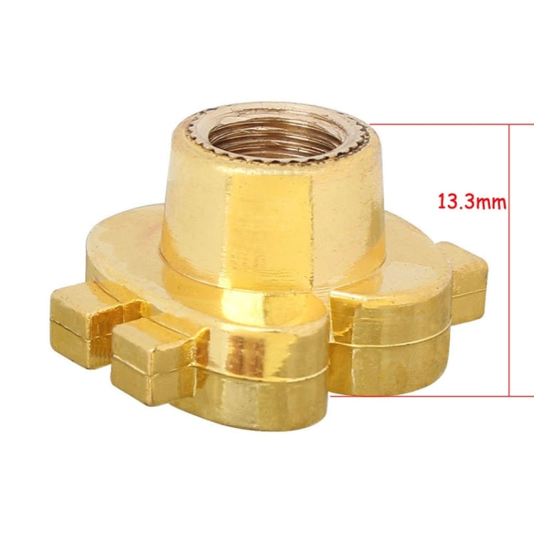 Gold tire valve cap underside with threaded inlet and mounting tabs